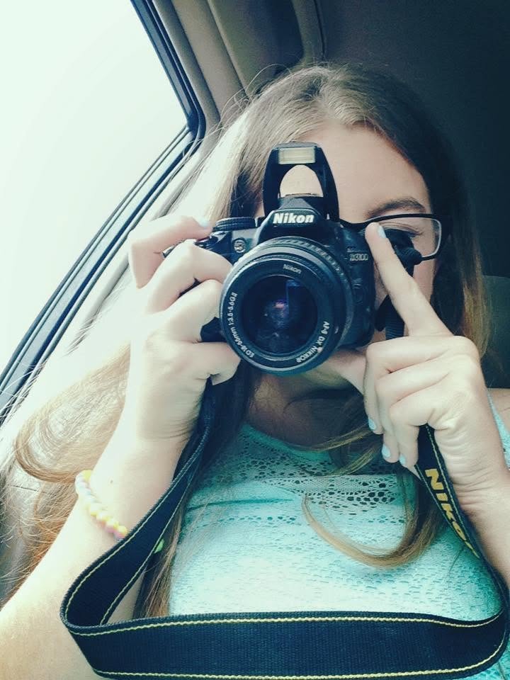 Abbey holding her camera